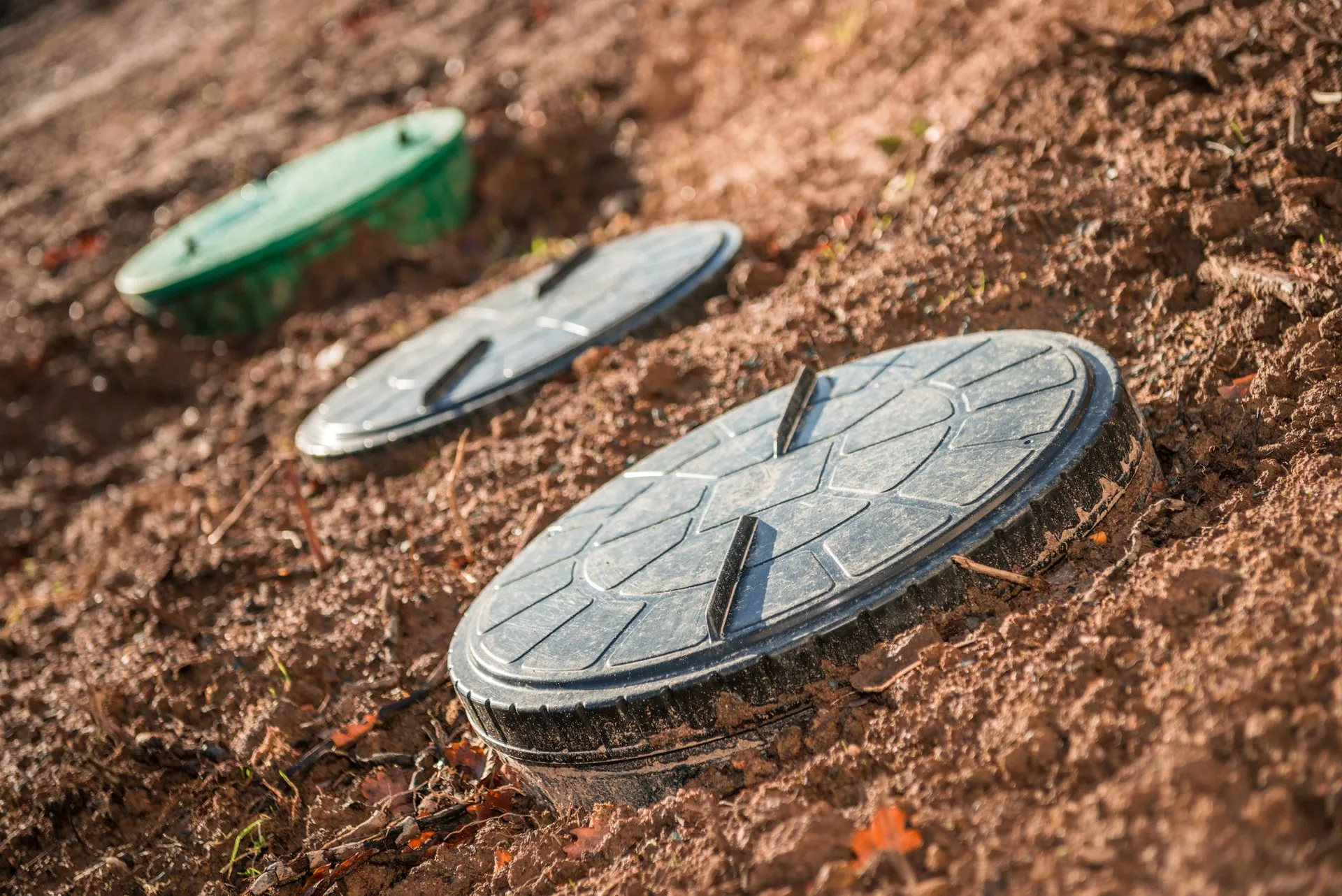 Septic system access covers at a work site